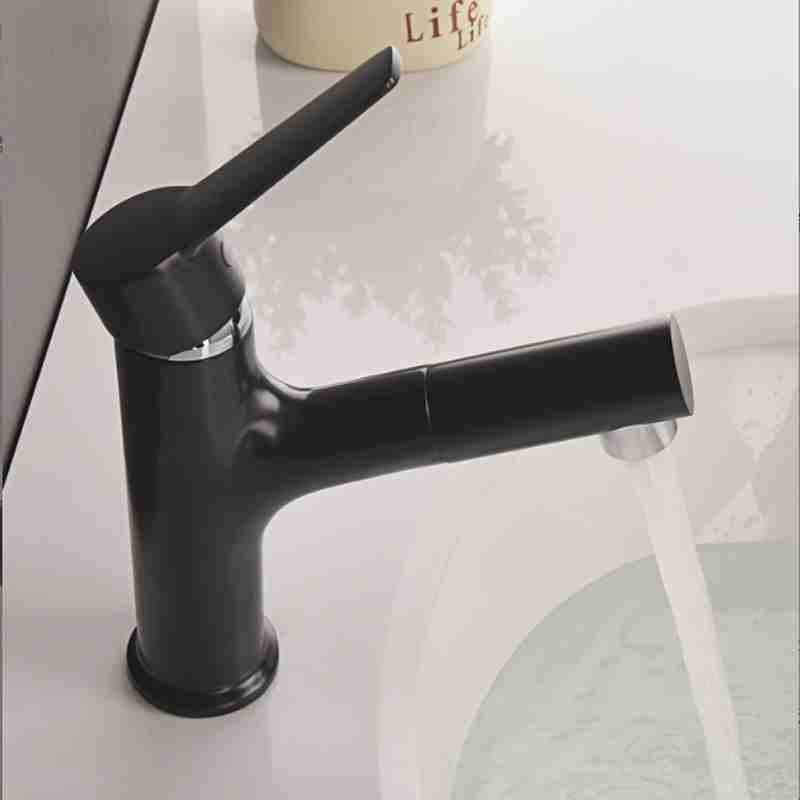 Full copper black circular pull-out faucet on the washbasin countertop in the bathroom
